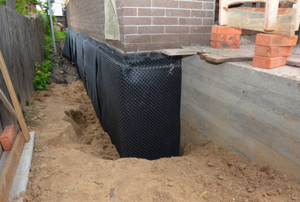 SJ Waterproofing Pros technician performing targeted Waterproofing assessment in Fairview, NY